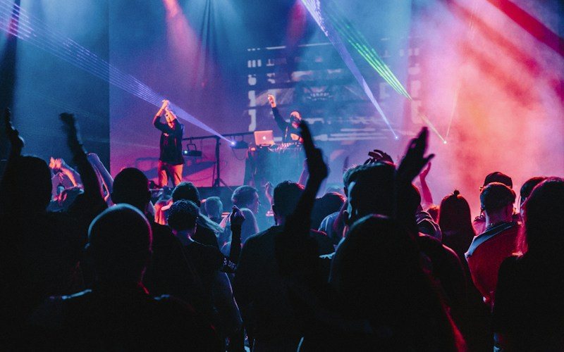 Performer on stage in dramatic lighting